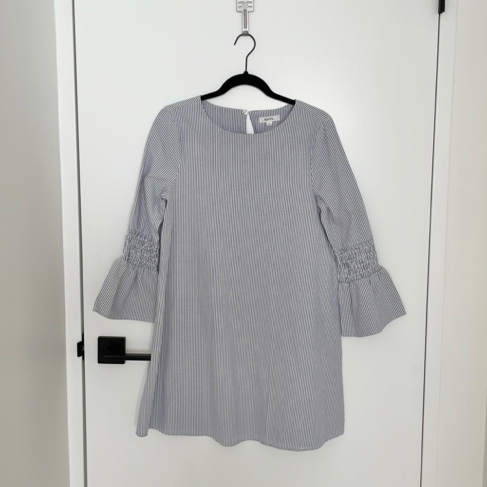 Stripped dress with ruffled detail on sleeves